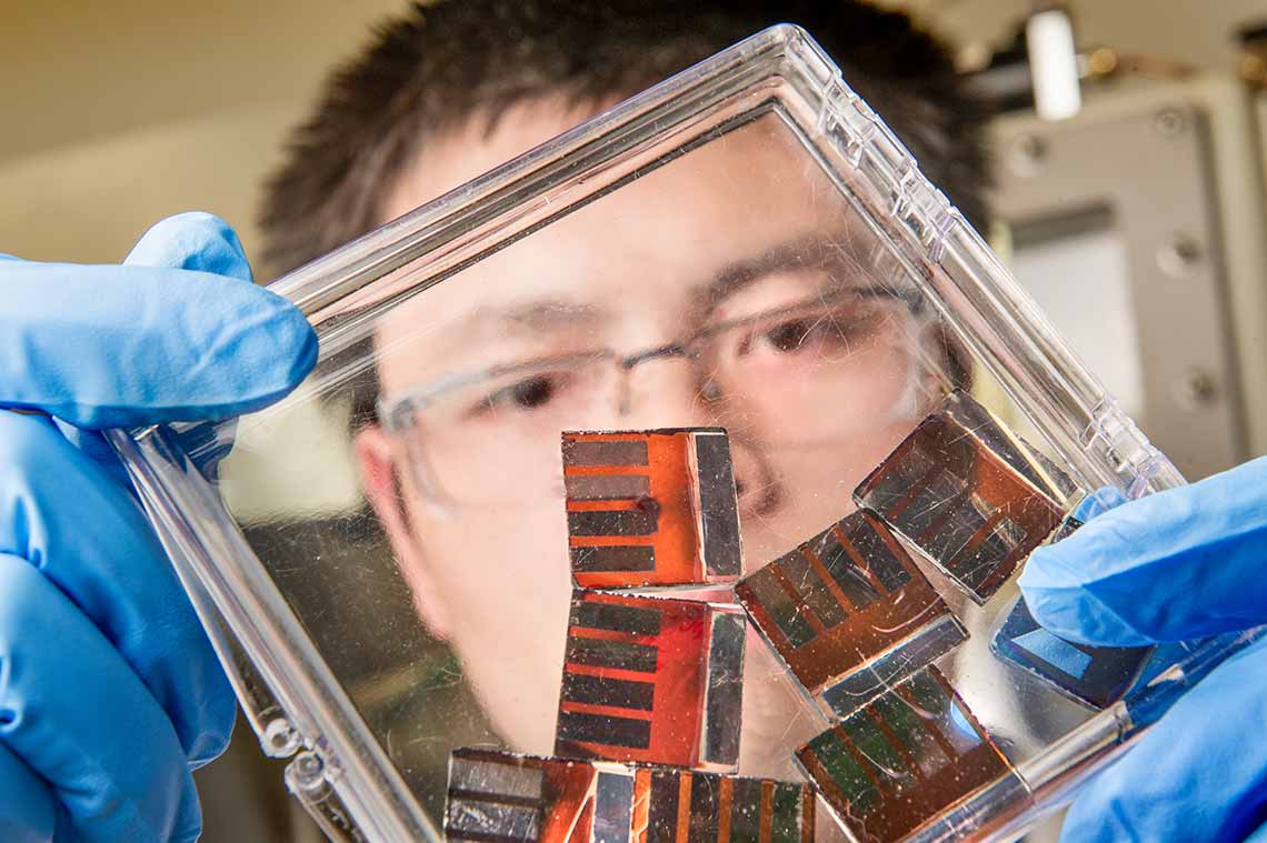 Scientist working with glass